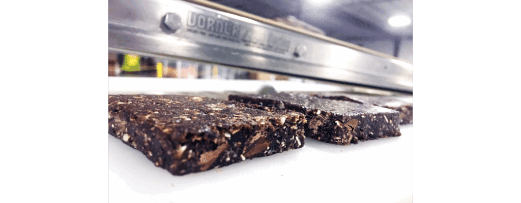 Two date paste bars in close-up on a production line in a food manufacturing facility
