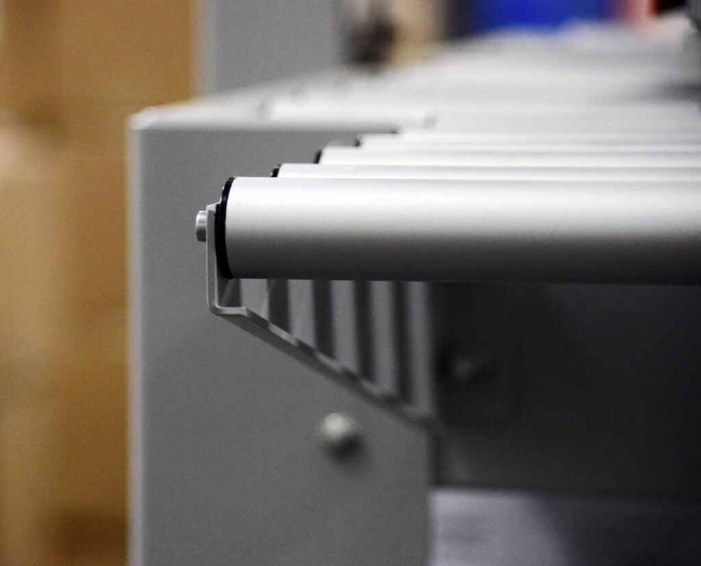 Close-up of a stainless roller conveyor on a food production line