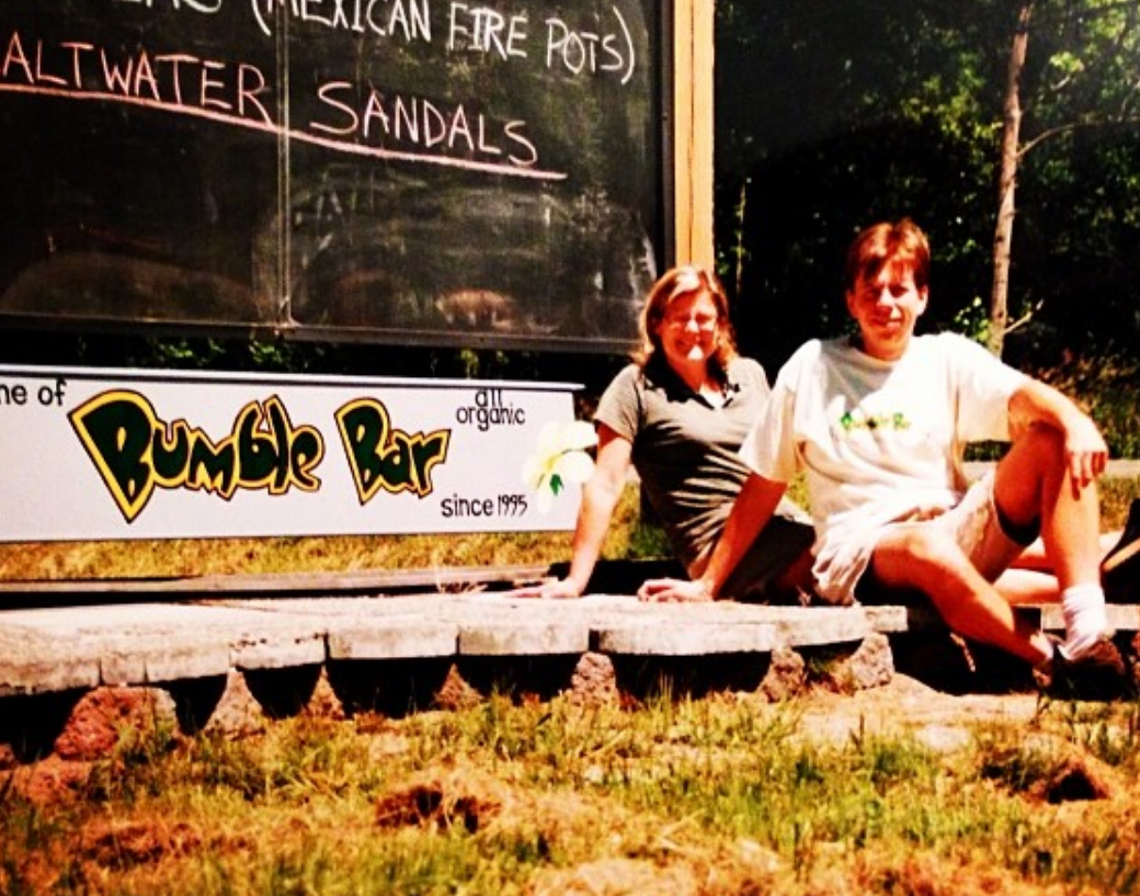 Glenn and Liz Ward beside the hand-painted Home of BumbleBar sign on Vashon Island in the late 1990s
