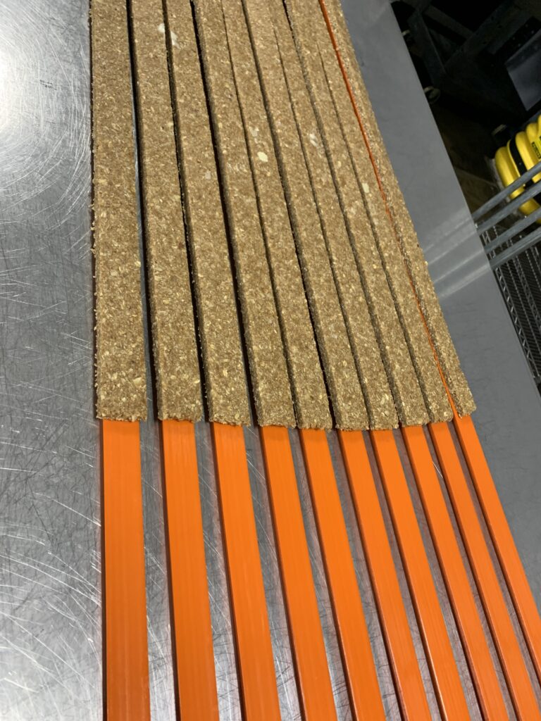Cut slab strips on orange dividers during the cutting process
