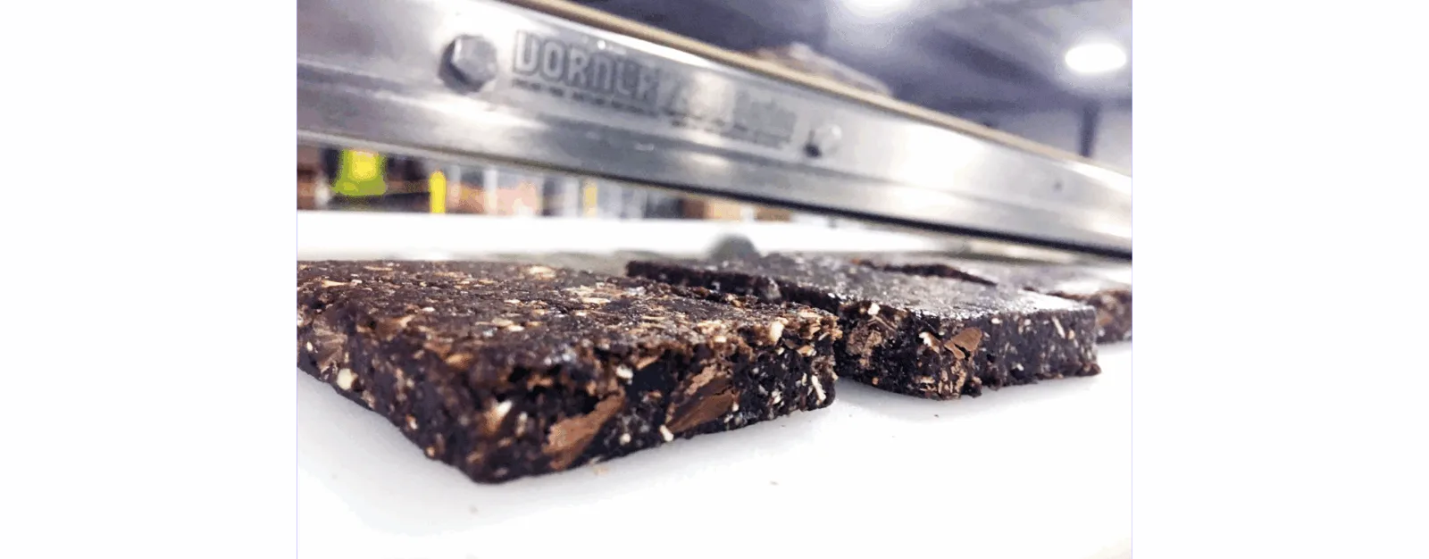 Two date paste bars in close-up on a production line in a food manufacturing facility